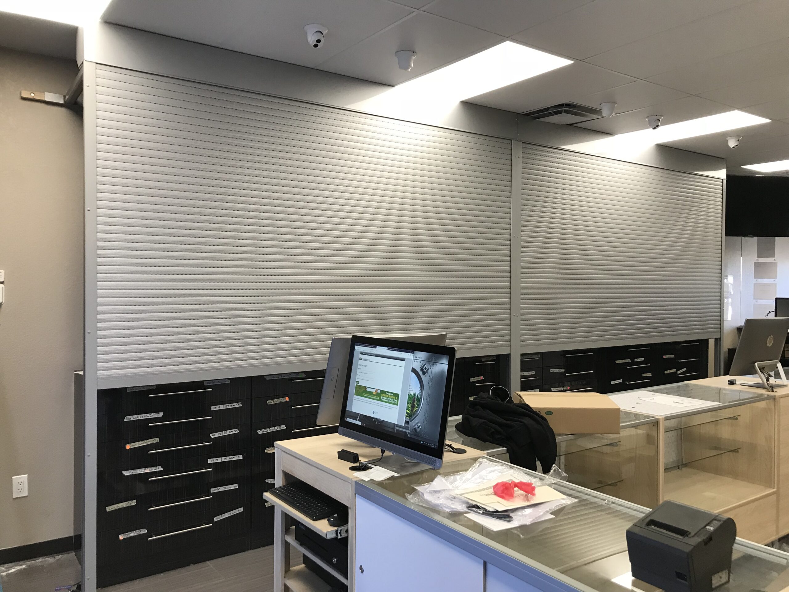 An image showing closed interior commercial rolling shutters 