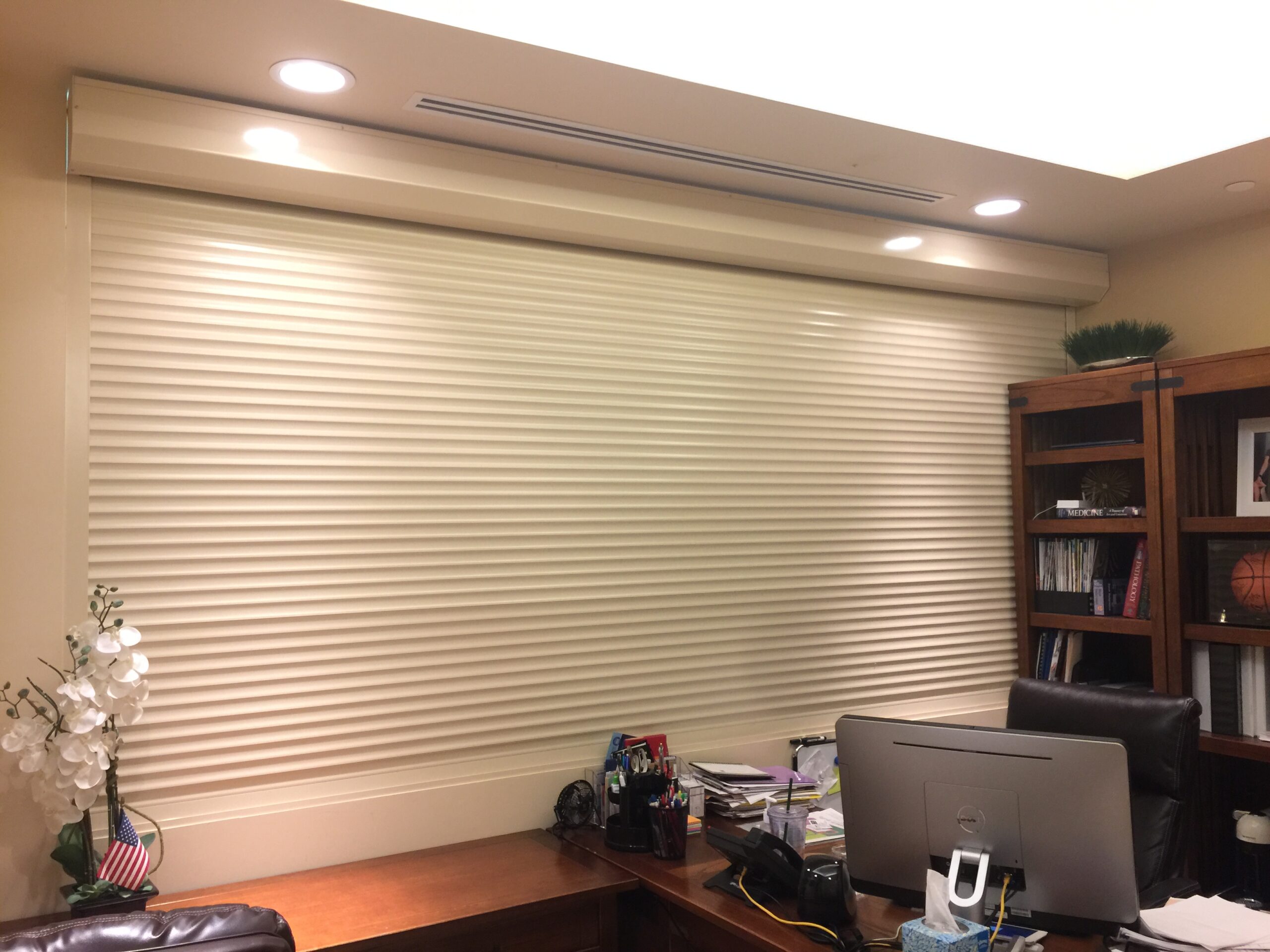 An image showing closed rolling shutters inside an office