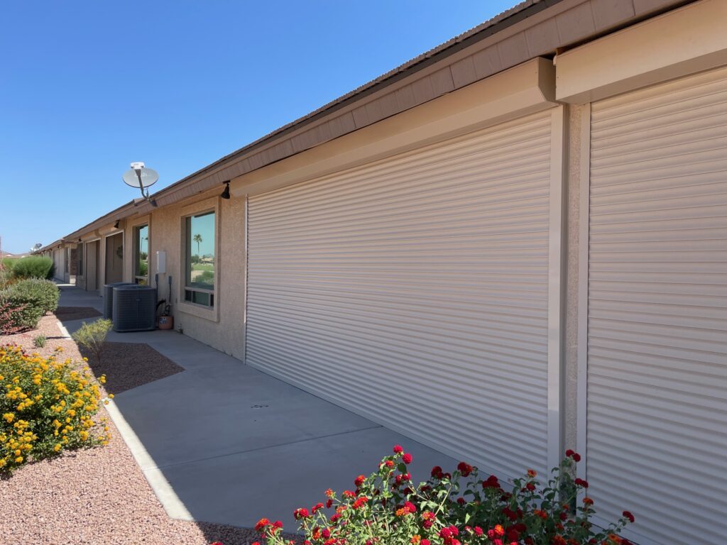 An image showing a residential property covered with a rolling shutter to defend it from direct sunlight