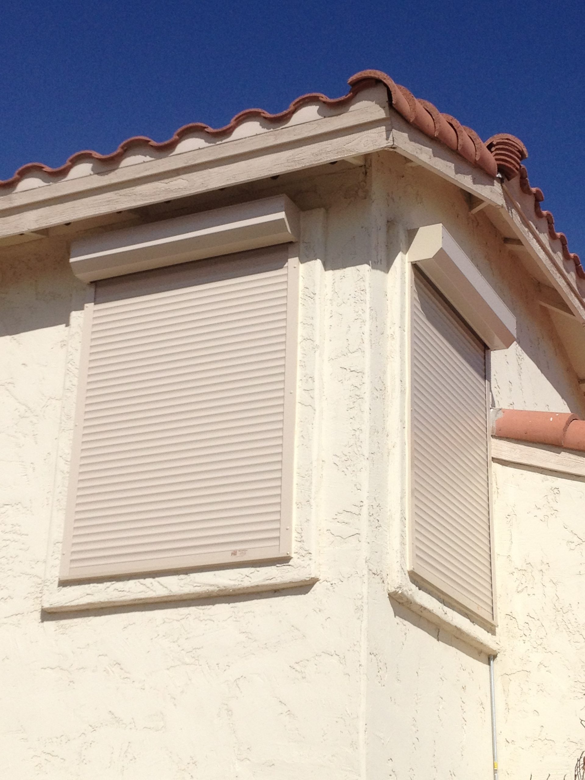 Second-story windows protected by closed security blinds