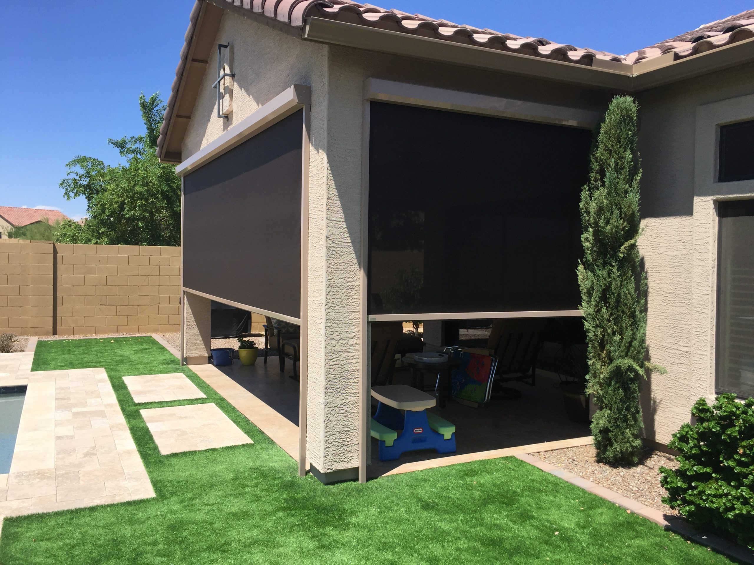 Charcoal motorized retractable patio screen installation in Phoenix AZ corner patio