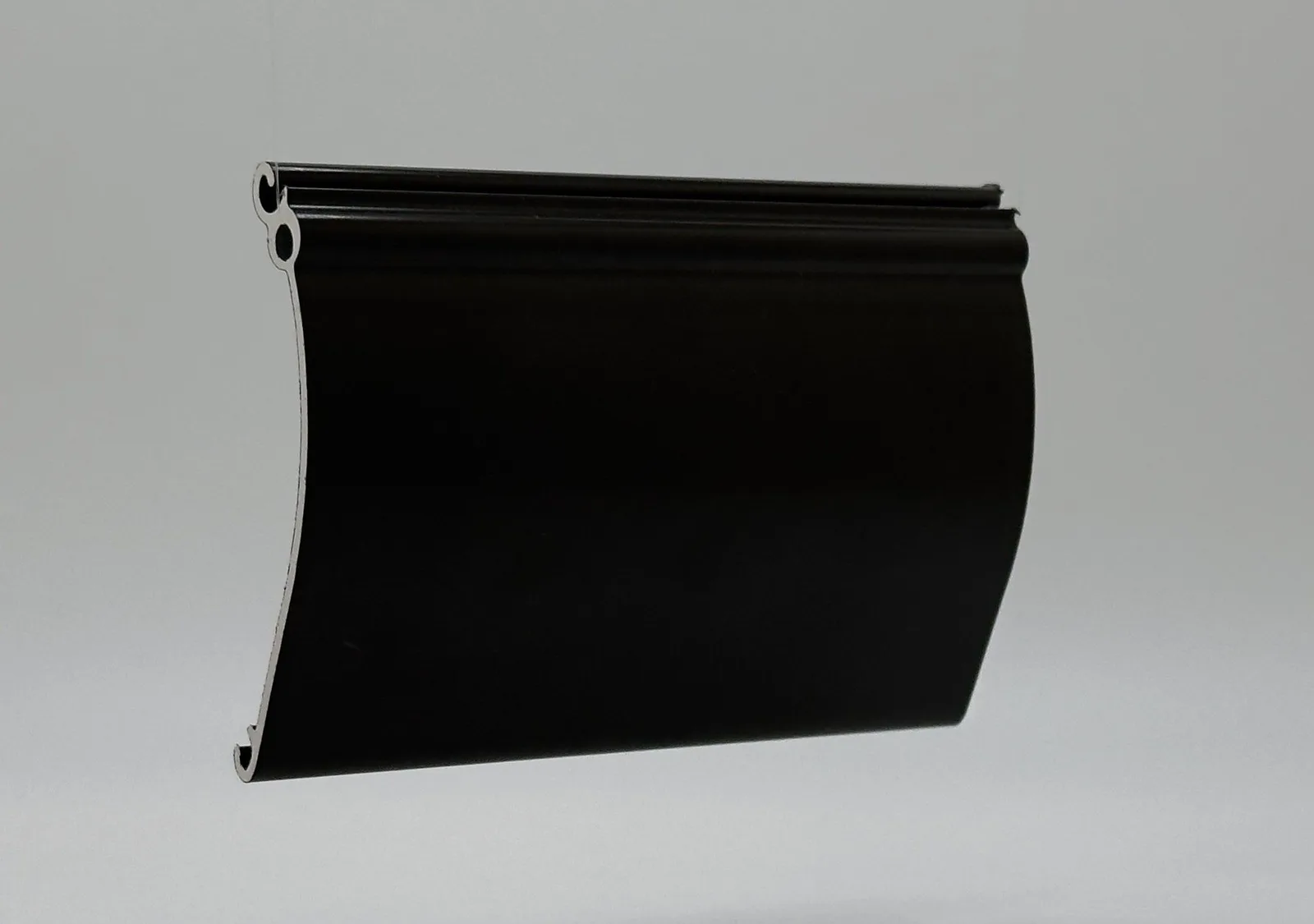 Slanted close-up of a Roll-A-Shield 63mm heavy-duty single-wall solid aluminum slat for commercial and hurricane motorized shutters