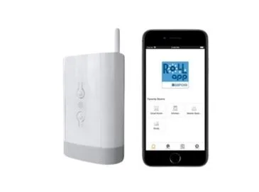 Somfy TaHoma smart-home hub next to a smartphone running the Roll-A-Shield app for voice and remote control of motorized shutters