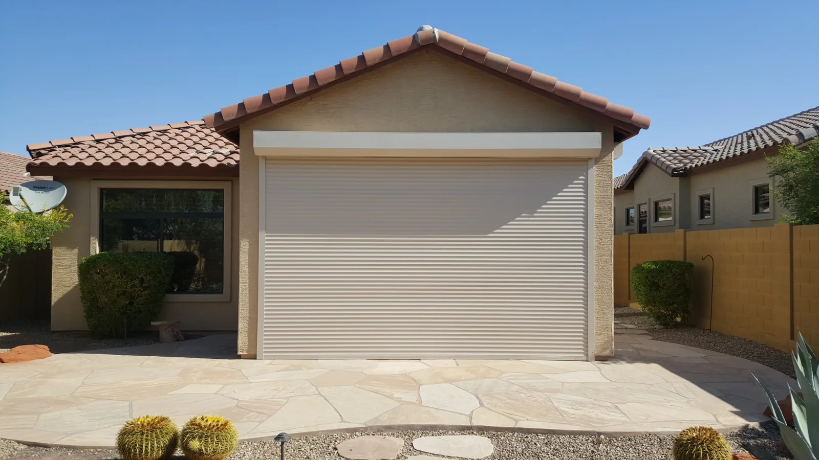 Extruded rolling shutter installed over a patio opening on an Arizona home