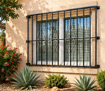 Black decorative security bars installed over a residential window