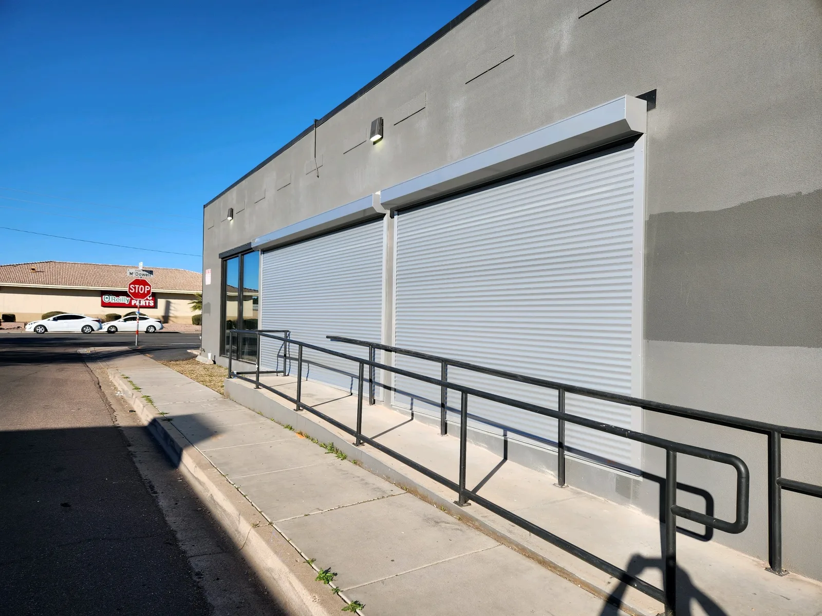 Commercial storefront with insulated rolling shutters installed over glass display windows