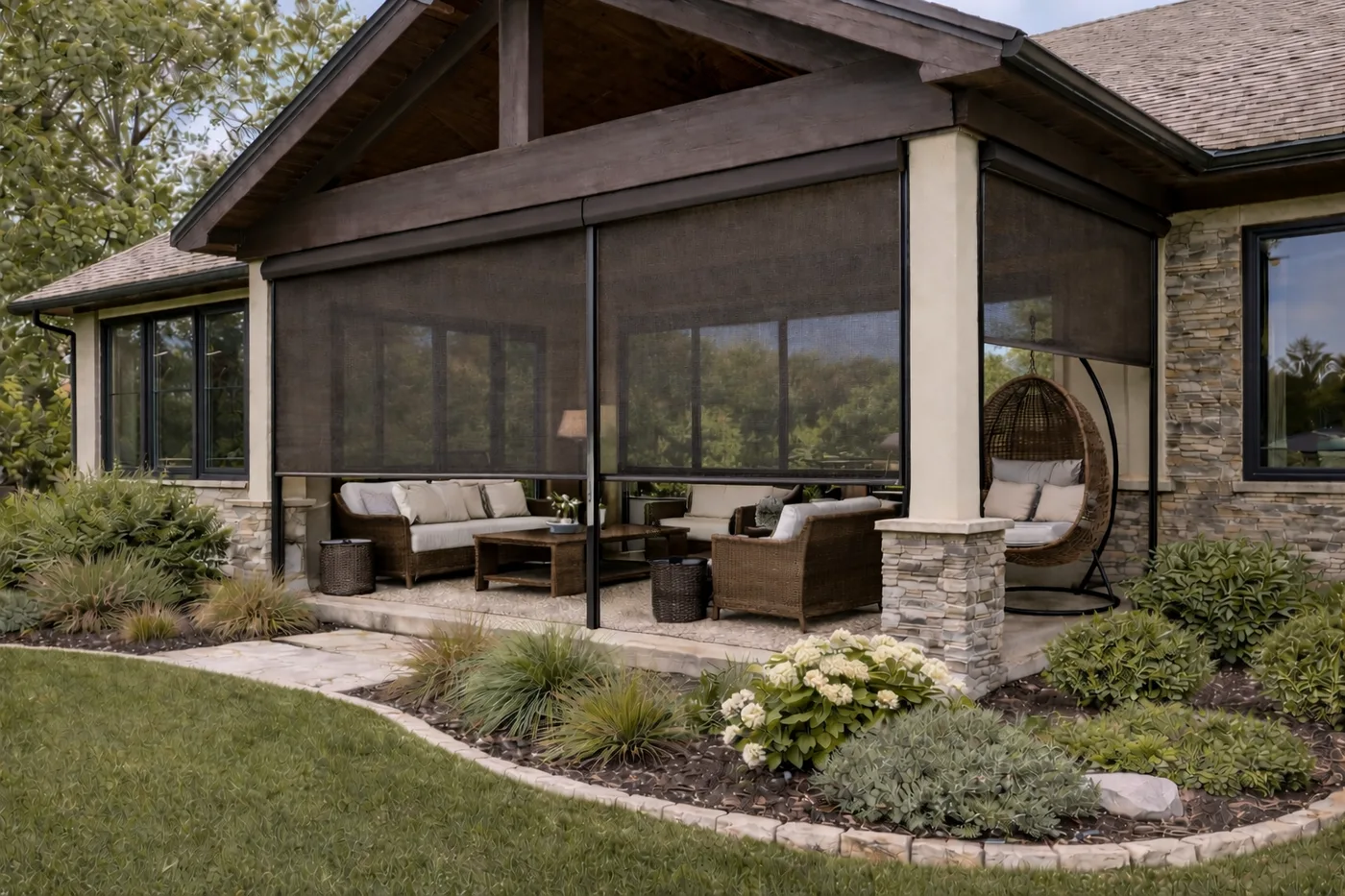 Screened porch with dark rolling screens enclosing an outdoor living room on a Metro Phoenix home