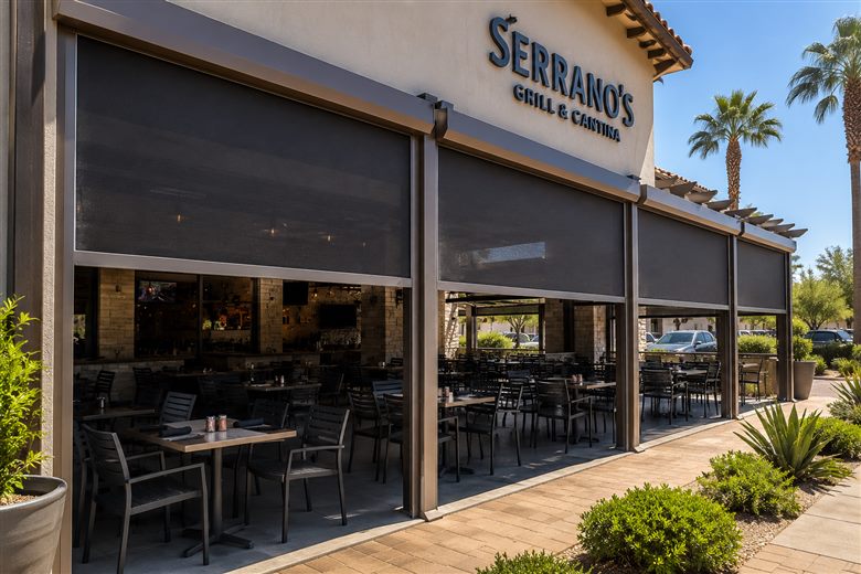 Rolling screens shading the patio of a Phoenix restaurant and cantina
