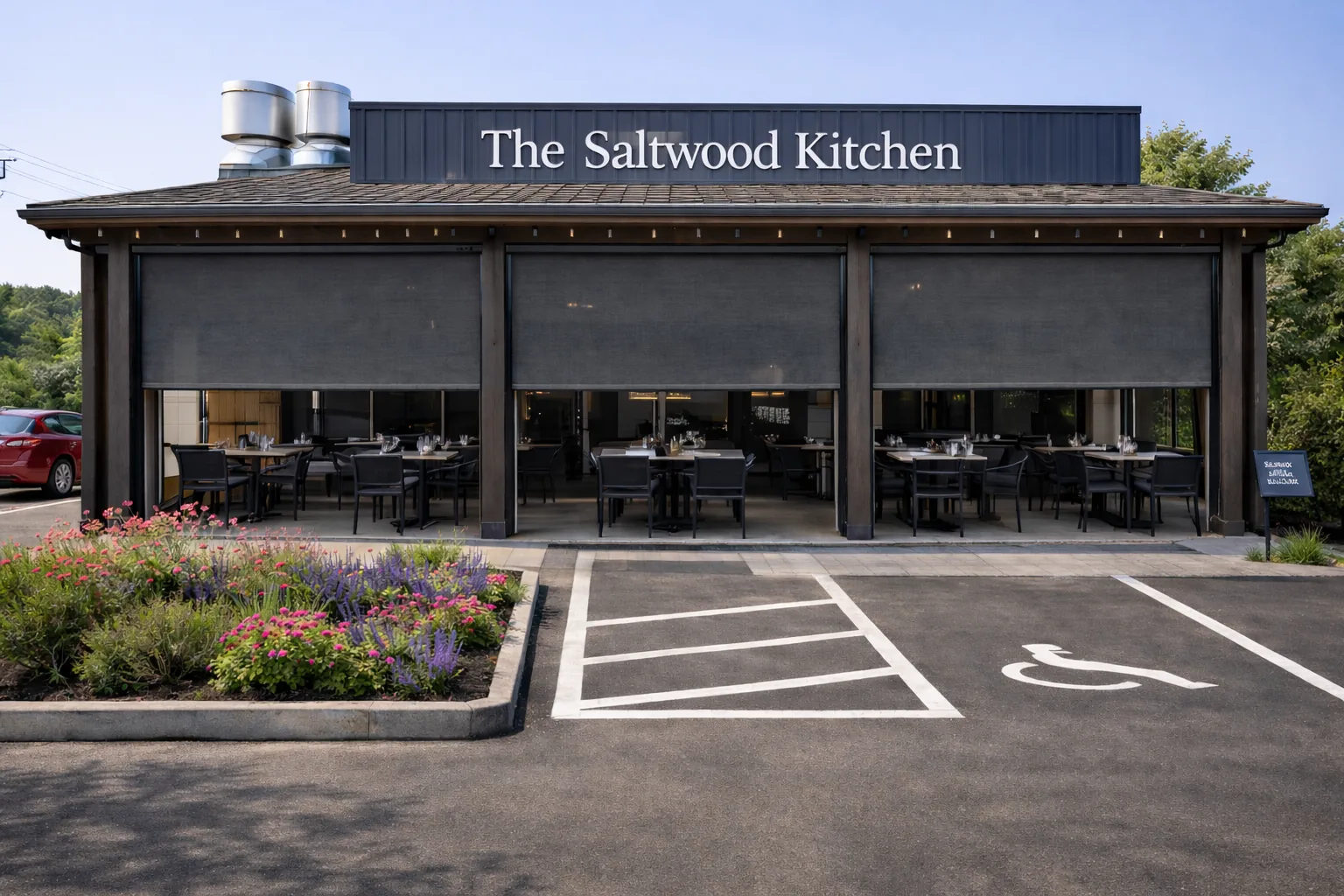 Screens lowered across the covered outdoor dining terrace of a restaurant