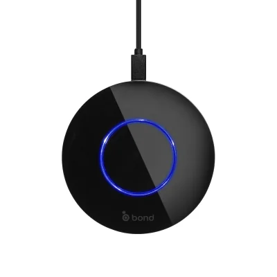 A black smart-home hub with a glowing blue ring, the bridge that runs motorized shutters and screens by schedule or voice