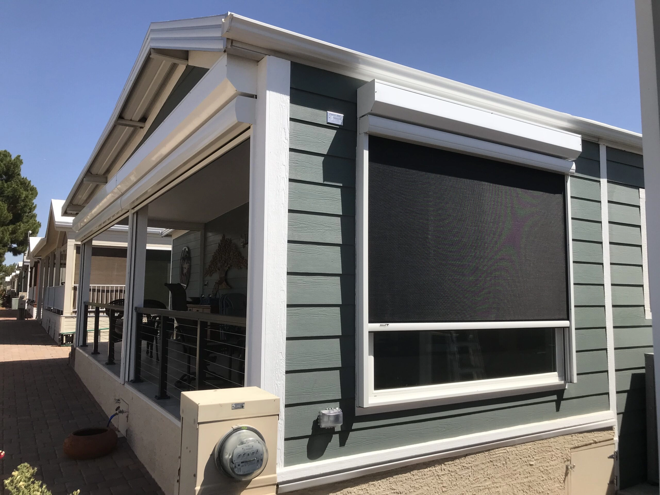 Rolling screens over sliding glass doors and windows on a Metro Phoenix home